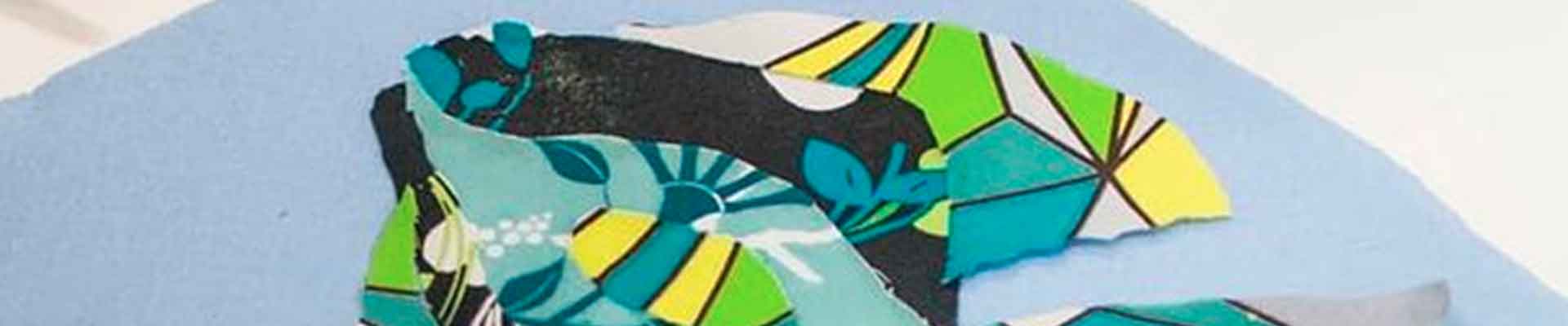 Zdjęcie kolażu w formie ryby z tkaniny na papierze