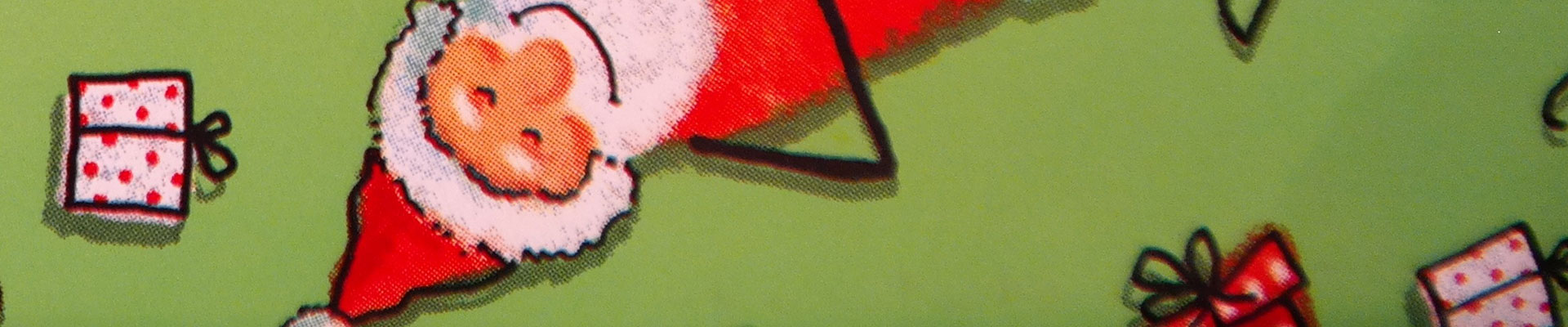 Na zdjęciu widać rysunek Mikołaja odwróconego do góry nogami na zielonym tle.